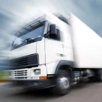 Speeding white truck